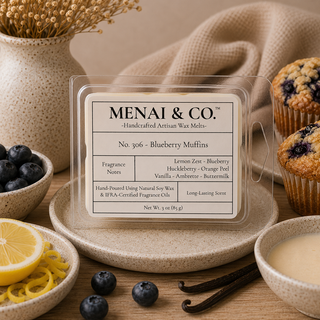Blueberry muffins soy wax melts in six-cavity clamshell styled with fresh blueberries, lemon zest, vanilla beans, warm muffins, and soft neutral decor