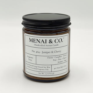 soy candle No. 404 Juniper and Cherry amber jar white background centered