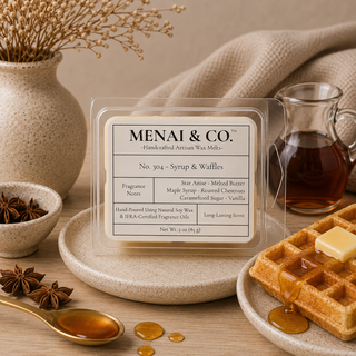 Syrup and waffles soy wax melts in six-cavity clamshell styled with maple syrup, waffles, star anise, soft linen, and warm neutral decor