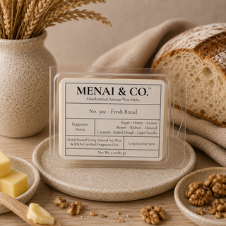Fresh Bread soy wax melts in six-cavity clamshell styled with artisan bread, honey dipper, butter, walnuts, and warm neutral kitchen decor