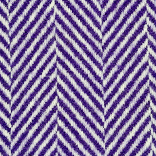Close-up texture detail of a purple herringbone recycled wool blanket showing the woven herringbone pattern and soft wool fibers