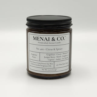 soy candle No. 402 Citrus and Spruce amber jar white background centered