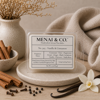 Vanilla and cinnamon soy wax melts in six-cavity clamshell styled with cinnamon sticks, vanilla beans, cloves, soft linen, and warm neutral decor